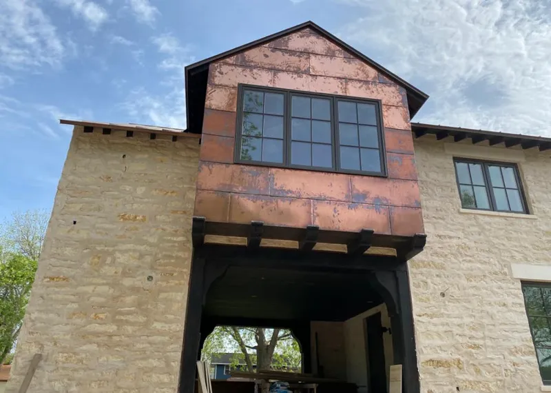Copper metal panel facade on a stone building for Metal Roof Coating in Accokeek